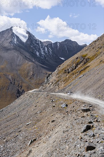 Off-road car on mountain pass, gravel road in the mountains in the Tien Shan, Engilchek Valley, Kyrgyzstan, Issyk Kul, Kyrgyzstan, Asia