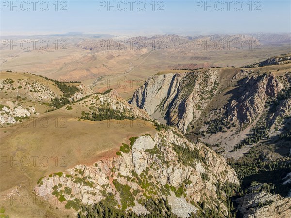 Moldo-Ashuu Pass, mountain landscape with steep rocks between yellow hills, near Baetov, Naryn region, Kyrgyzstan, Asia