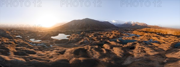 Atmospheric aerial view, high mountain landscape with glacier moraines and mountain lakes, behind Pik Lenin, Trans Alay Mountains, Pamir Mountains, Osher Province, Kyrgyzstan, Asia