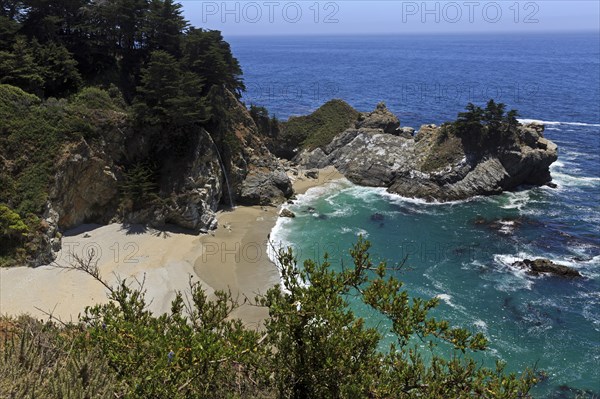 A waterfall pours into the sea on a sandy beach, Big Sur Pfeiffer, US 1, North America, USA, South-West, California, California, North America