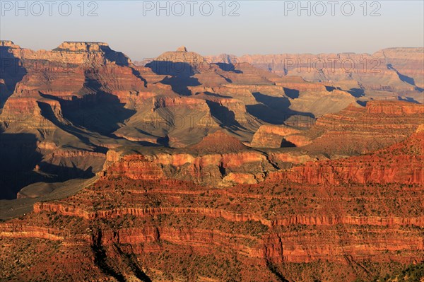 The sun bathes the Grand Canyon in a warm, orange-red light, Grand Canyon National Park, South Rim, North America, USA, South-West, Arizona, North America