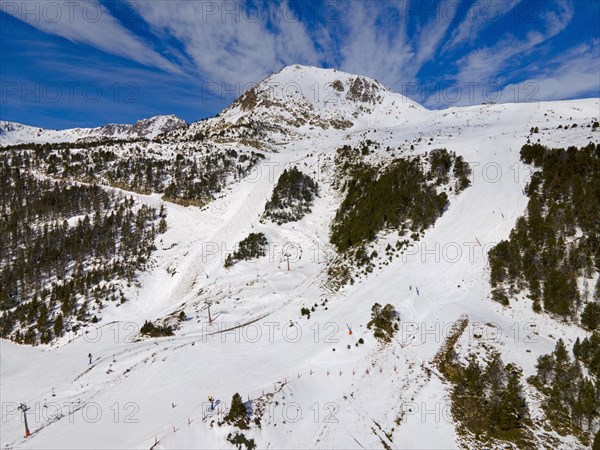 Image of a mountain peak with ski lifts not far from wooded slopes, Grau Roig, Encamp, Andorra, Pyrenees, Europe