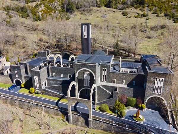 Aerial view of a historic monastery complex surrounded by greenery and Cypress trees, Santuario de Meritxell Monastery, Sanctuary of Our Lady of Meritxell, Meritxell, Canillo, Andorra, Pyrenees, Europe