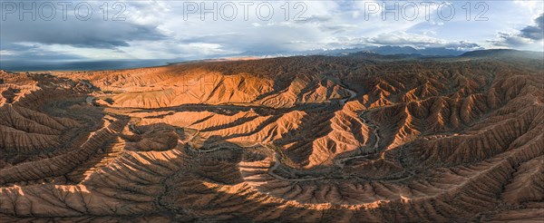 Aerial view, Panorama, Canyon runs through landscape, Issyk Kul Lake, Dramatic barren landscape of eroded hills, Badlands, Canyon of the Forgotten Rivers, Issyk Kul, Kyrgyzstan, Asia