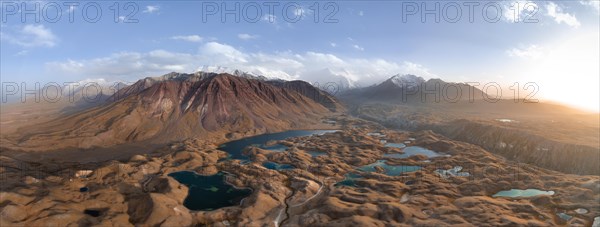 Atmospheric aerial view, high mountain landscape with glacier moraines and mountain lakes, behind Pik Lenin, Trans Alay Mountains, Pamir Mountains, Osher Province, Kyrgyzstan, Asia