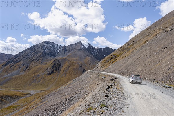 Off-road car on mountain pass, gravel road in the mountains in the Tien Shan, Engilchek Valley, Kyrgyzstan, Issyk Kul, Kyrgyzstan, Asia