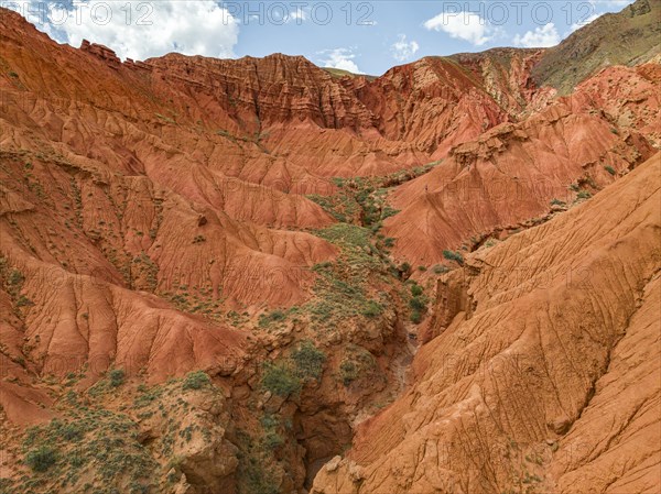 Badlands, canyon with eroded red sandstone rocks, Konorchek Canyon, Boom Gorge, aerial view, Kyrgyzstan, Asia