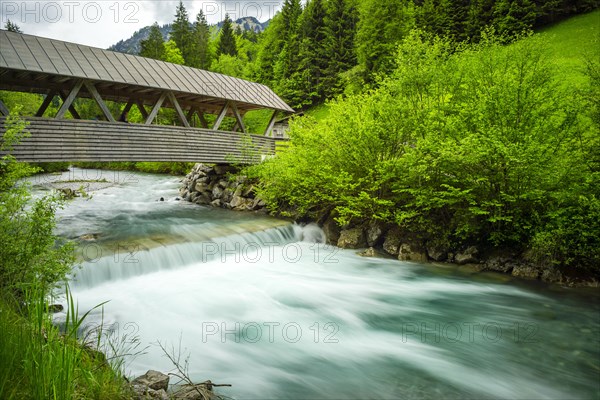 Covered wooden bridge over the Stillach, Stillachtal near Oberstdorf, Allgaeu Alps, Allgaeu, Bavaria, Germany, Europe