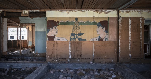 Abandoned building, ruins of an old school from the USSR Ghost town Enilchek in the Tien Shan Mountains, Ak-Su, Kyrgyzstan, Asia