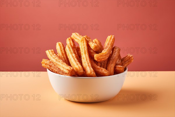 Churros in bowl, a fried dough dessert from Spanish and Portuguese cuisine. KI generiert, generiert, AI generated