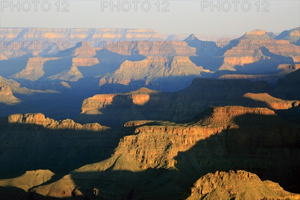In the golden hour, the light illuminates the plateaus of the Grand Canyon, Grand Canyon National Park, South Rim, North America, USA, South-West, Arizona, North America
