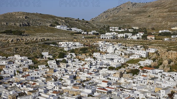 Lindos village, Whitewashed houses of a Greek village in a mountainous landscape, Lindos, Rhodes, Dodecanese, Greek Islands, Greece, Europe