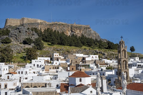 View of the Acropolis and the white houses of Lindos, Rhodes, Dodecanese archipelago, Greek Islands, Greece, Europe