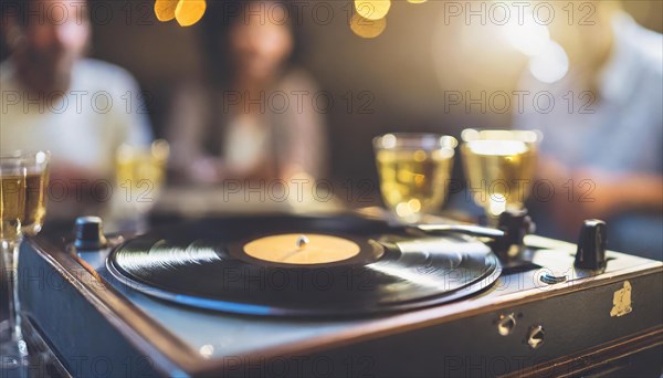A turntable playing a vinyl record with champagne glasses and festive defocused lights in the background, AI generated