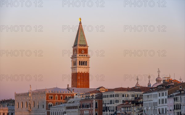 Campanile bell tower and Doge's Palace at sunrise, waterfront promenade, Venice, Veneto, Italy, Europe