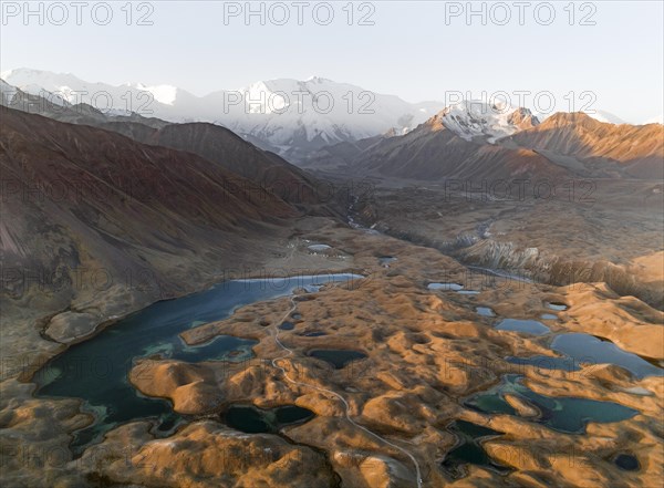 Aerial view, high mountain landscape with glacial moraines and mountain lakes, behind Pik Lenin, Trans Alay Mountains, Pamir Mountains, Osher Province, Kyrgyzstan, Asia