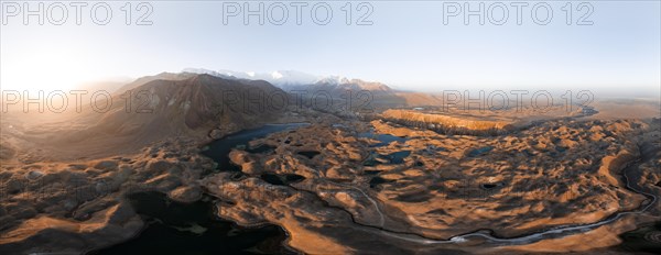 Atmospheric aerial view, high mountain landscape with glacier moraines and mountain lakes, behind Pik Lenin, Trans Alay Mountains, Pamir Mountains, Osher Province, Kyrgyzstan, Asia