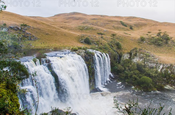 Green waterfall-river-rocks-covered with green moss-forest-waterfall. deep forest in the center of the forest with a waterfall. peaceful and pleasant environment for tourism. very deep forest area