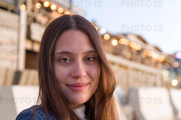 Beautiful young woman looking to the side on Uruguayan beach