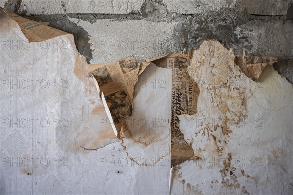 Old newspapers on the wall from the USSR, Abandoned ruins, Ghost town Enilchek in the Tien Shan Mountains, Ak-Su, Kyrgyzstan, Asia