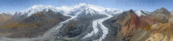 Aerial view, panorama, high mountain landscape with glacier moraines and glacier tongues, glaciated and snow-covered mountain peaks, Lenin Peak and Peak of the XIX Party Congress of the CPSU, Traveller's Pass, Trans Alay Mountains, Pamir Mountains, Osher Province, Kyrgyzstan, Asia