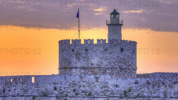 An illuminated fortress during the blue hour with a clear sky, sunrise, dawn, Fort of Saint Nikolaos, harbour promenade, Rhodes, lighthouse, Dodecanese, Greek Islands, Greece, Europe