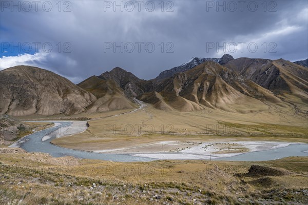 Mountain valley with Sary Jaz river, autumn mountains with yellow grass, Tien Shan, Kyrgyzstan, Asia