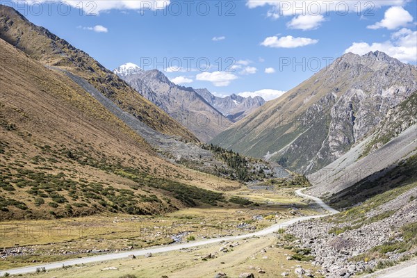 Gravel road in the mountains of the Tien Shan, mountain valley, Kyrgyzstan, Issyk Kul, Kyrgyzstan, Asia
