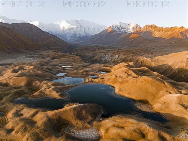 Aerial view, high mountain landscape with glacial moraines and mountain lakes, behind Pik Lenin, Trans Alay Mountains, Pamir Mountains, Osher Province, Kyrgyzstan, Asia