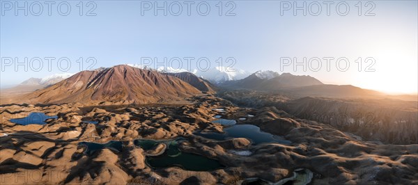 Atmospheric aerial view, high mountain landscape with glacier moraines and mountain lakes, behind Pik Lenin, Trans Alay Mountains, Pamir Mountains, Osher Province, Kyrgyzstan, Asia