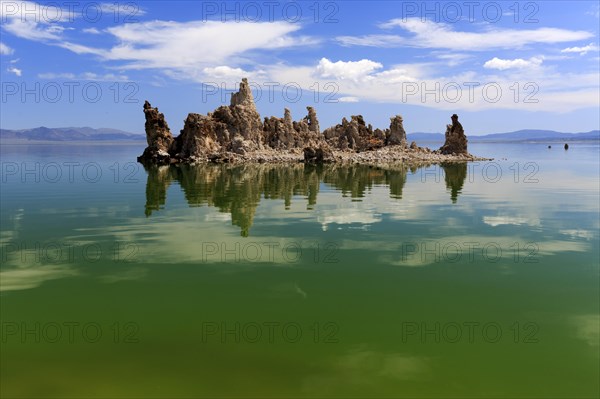 Tufa formation in the middle of a clear lake on a sunny day with blue sky, Mono Lake, North America, USA, South-West, California, California, North America