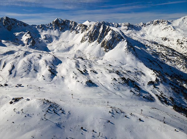 Panoramic view of snow-covered mountains with ski lifts, Grau Roig, Encamp, Andorra, Pyrenees, Europe