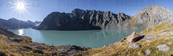 Panorama, Mountain landscape at the turquoise Ala Kul mountain lake in the morning light, Sun Star, Tien Shan Mountains, Kyrgyzstan, Asia