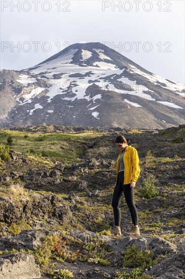 Young women in front of the volcano, Villarrica Volcano, Villarrica National Park, Araucania, Chil