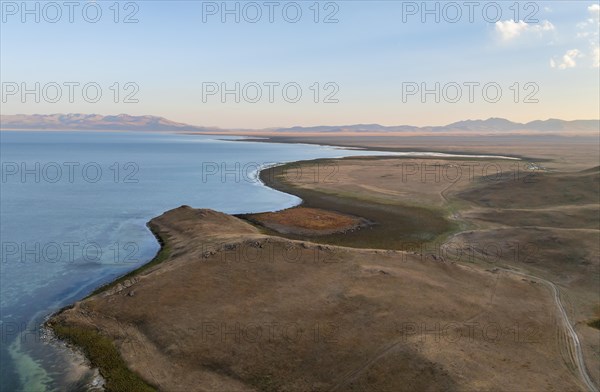 Aerial view, Vast empty landscape at the mountain lake Song Kul, Moldo Too Mountains, Naryn region, Kyrgyzstan, Asia