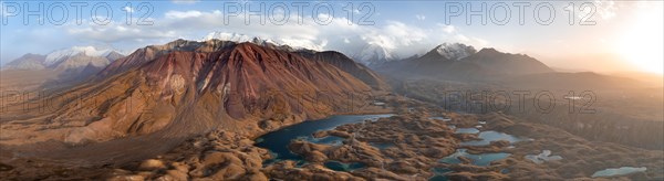 Atmospheric aerial view, high mountain landscape with glacier moraines and mountain lakes, behind Pik Lenin, Trans Alay Mountains, Pamir Mountains, Osher Province, Kyrgyzstan, Asia