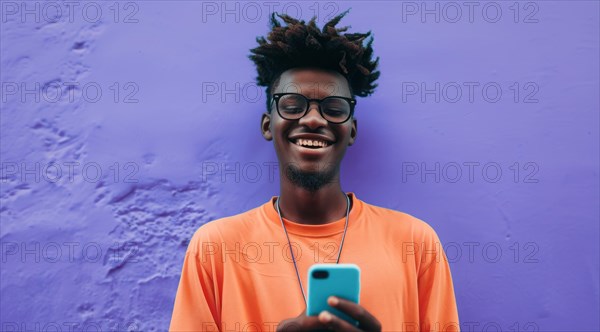 Black young positive man with dreadlocks is smiling and standing in front of the building wall. Concept of confidence and positivity, AI generated