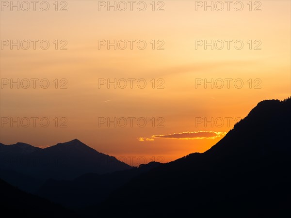 Sunset over mountain peaks, view from the lowlands, Leoben, Styria, Austria, Europe