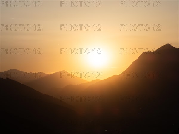 Sunset over a mountain peak, view from the lowlands, Leoben, Styria, Austria, Europe
