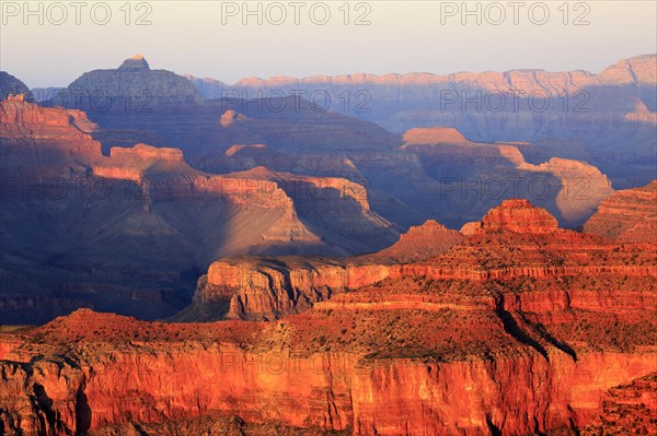 A new day begins with the sunrise that bathes the Grand Canyon in Orange, Grand Canyon National Park, South Rim, North America, USA, South-West, Arizona, North America