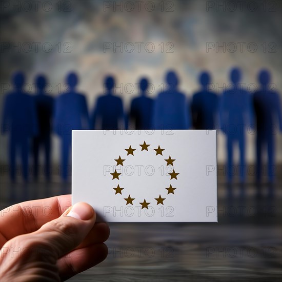 Hand holding a card with the EU flag in front of a group of human figures, AI generated