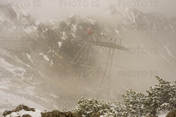 Cable car technicians working in bad weather conditions, Nebelhorn cable car near Oberstdorf, Allgaeu Alps, Allgaeu, Bavaria, Germany, Europe