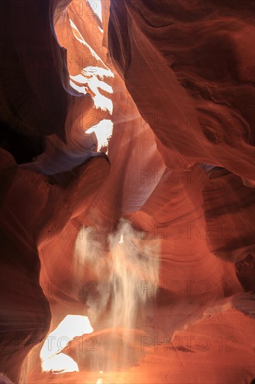 Sunbeams dance on the eroded surfaces of a narrow canyon, Upper Antelope Canyon, North America, USA, South-West, Arizona, North America