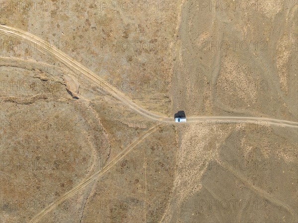 Aerial view, Vast empty landscape, Road and off-road vehicle, Top down view, Two paths divide, Symbolic for decisions, Moldo Too mountains, Naryn region, Kyrgyzstan, Asia