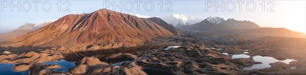 Atmospheric aerial view, high mountain landscape with glacier moraines and mountain lakes, behind Pik Lenin, Trans Alay Mountains, Pamir Mountains, Osher Province, Kyrgyzstan, Asia