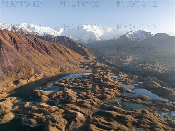 Aerial view, high mountain landscape with glacial moraines and mountain lakes, behind Pik Lenin, Trans Alay Mountains, Pamir Mountains, Osher Province, Kyrgyzstan, Asia