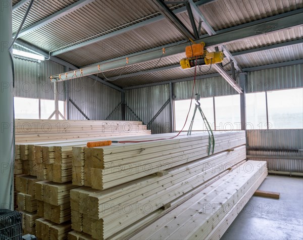 At sawmill. View on loading of wooden bars, close-up