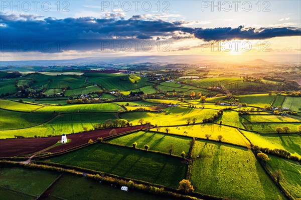 Sunset of Devon Windmill over Fields and Farms from a drone, Torquay, Devon, England, United Kingdom, Europe