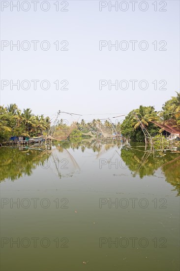 Chinese fishing nets on the AS Canal from Alappuzha to Vembanad Lake, Kerala, India, Asia
