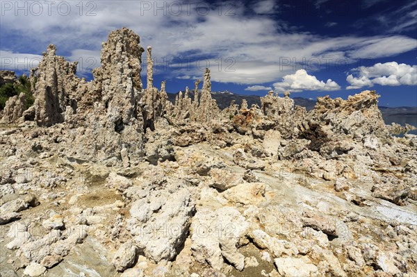 Sharp-edged tufa towers against a cloudy sky in a rugged landscape, Mono Lake, North America, USA, South-West, California, California, North America
